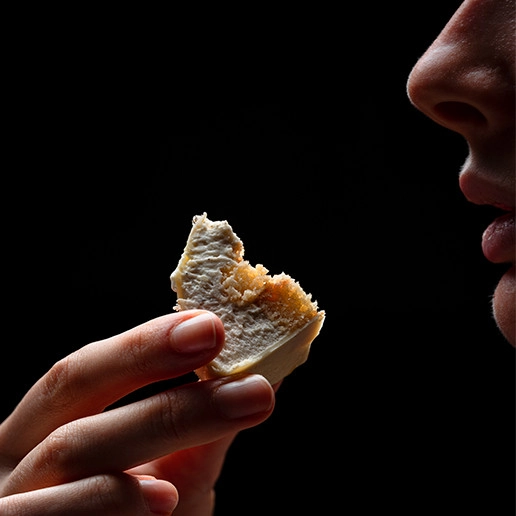 Woman enjoying a bite at the restaurant Dans le Noir ?
