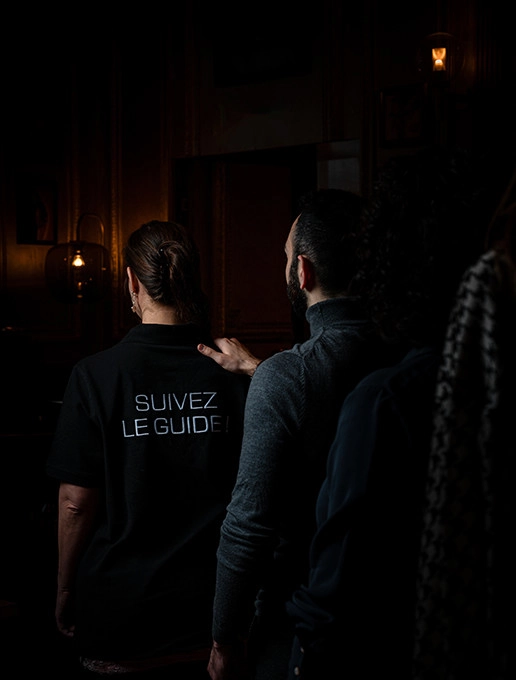 A group walking in single file, celebrating a bachelor party at the restaurant Dans le Noir ?
